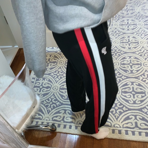 black sweatpants with red and white stripe